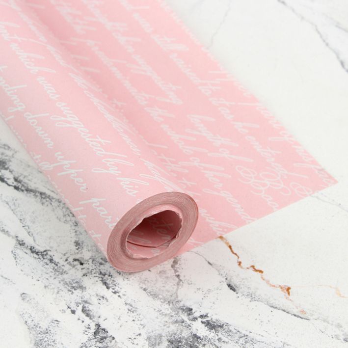 Крафт-папір для подарунків, рожевий з написами, 0.7×8 м в рулоні